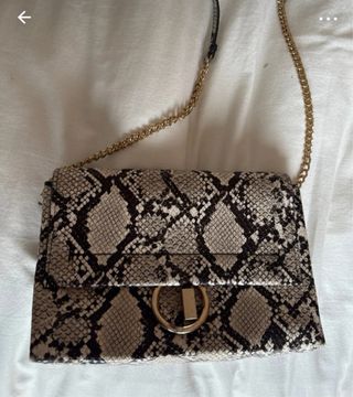 Bolso bandolera serpiente beige-negro nuevo.