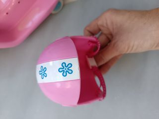 Moto Nancy rosa con casco