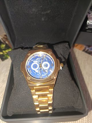 Reloj Skyline dorado azul