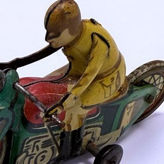 juguete Motorista Rai Paya en hojalata pintada