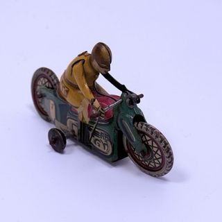 juguete Motorista Rai Paya en hojalata pintada