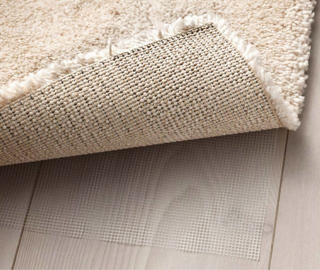 Alfombra de pelo corto en color beige