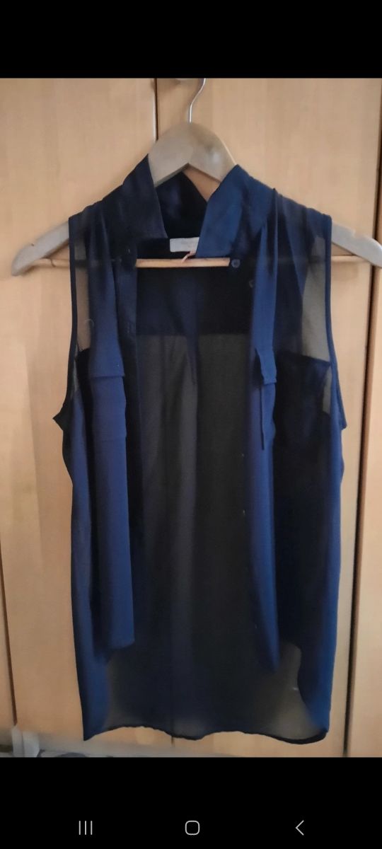 Blusa negra transparente sin mangas