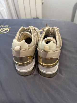 Zapatillas Michael Kors doradas