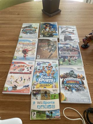 Wii + juegos, mandos , sensor y Skylanders.