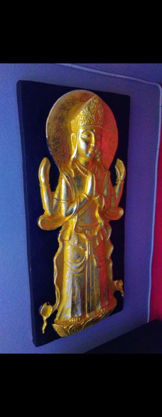 Relieve dorado Buda