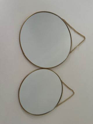 Espejos redondos dorados (x2)