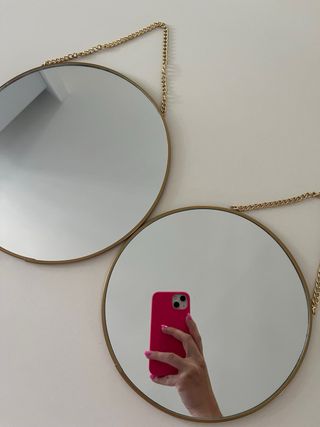 Espejos redondos dorados (x2)