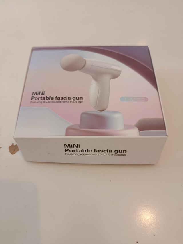 Mini pistola de masaje facial