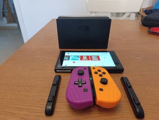 Nintendo Switch v1 - Naranja y Morada