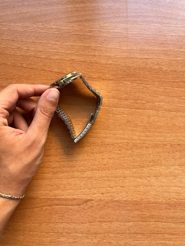 Reloj Berenson Quartz dorado y plateado