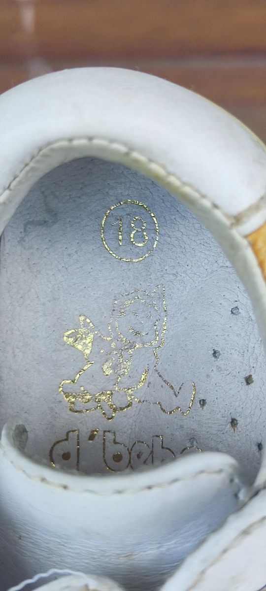 Zapatos blancos d'bebe