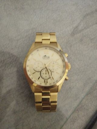 Reloj Lotus dorado, cambio por iPhone