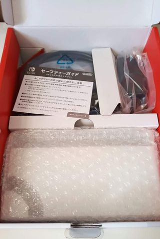 Nintendo Switch OLED in bianco e nero + 26 giochi