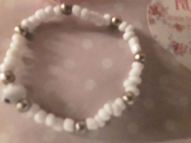 Pulsera niña plata y perla blanca,más piedras ónix