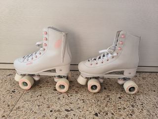 Patines Oxelo 4 ruedas n° 39. Cubrepatines y bolsa