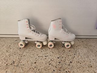 Patines Oxelo 4 ruedas n° 39. Cubrepatines y bolsa
