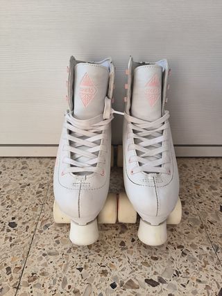 Patines Oxelo 4 ruedas n° 39. Cubrepatines y bolsa