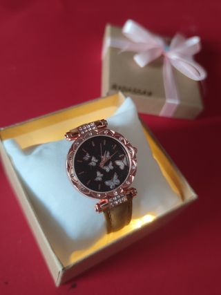 Reloj mariposa dorado