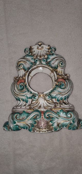 Scultura porta orologi antica