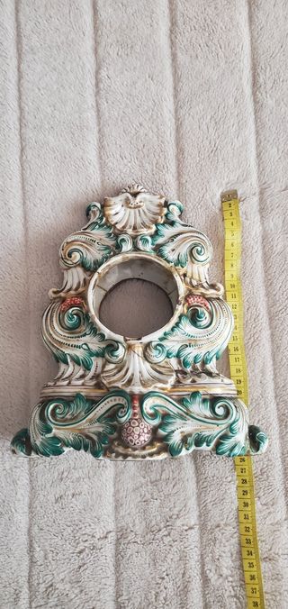 Scultura porta orologi antica