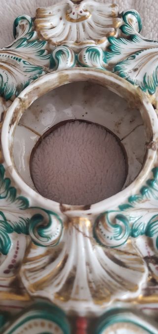 Scultura porta orologi antica