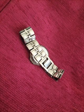 Reloj cuarzo dorado y plateado