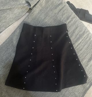 2 Faldas negras con detalles