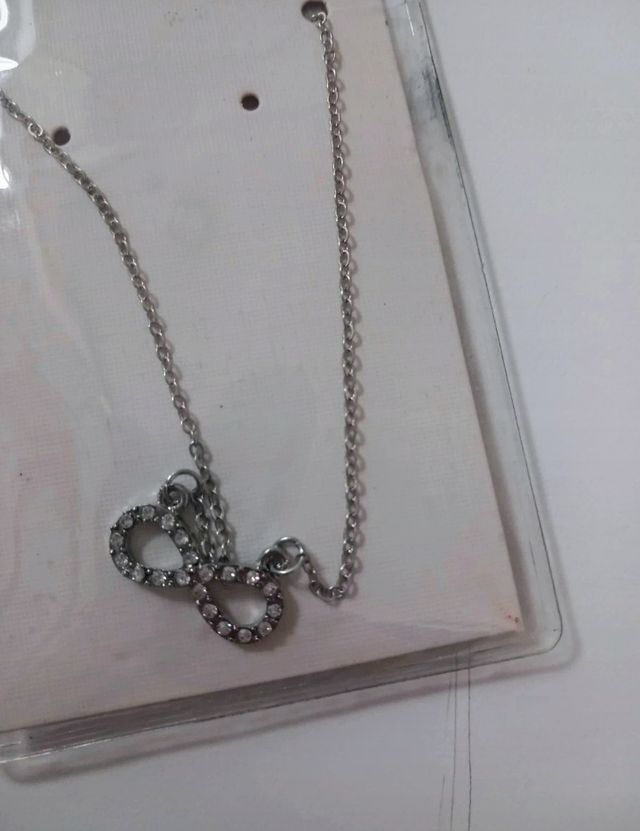 Collana e cavigliera con ciondolo infinito