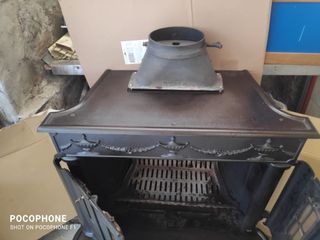Estufa Hergom antigua de metal para leña