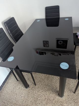 Mesa cristal negra más seis sillas