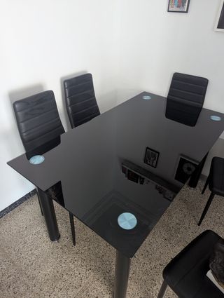 Mesa cristal negra más seis sillas