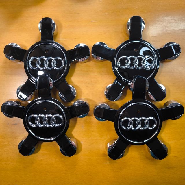 TAPABUJES AUDI 135mm NEGRO CONCAVOS - EMBLEMAS AUD