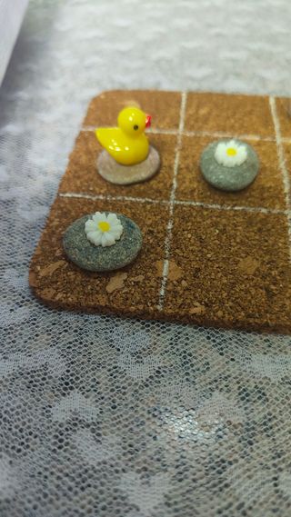 Tres en raya: patitos y flores.