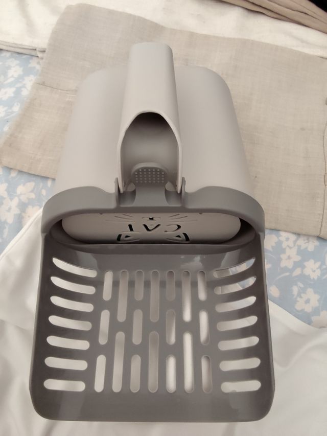 Pala para arena de gato