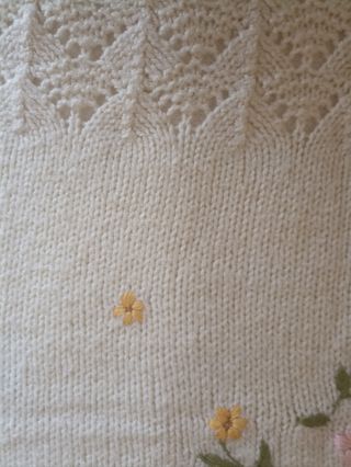 Copertina neonato ricamata.