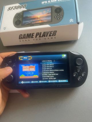 c0nsola portátil, con mas de 10.000 jueg0s