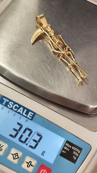 Colgante esqueleto con guadaña oro 18kt
