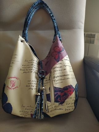 Bolso beige y morado estampado,sin usar.
