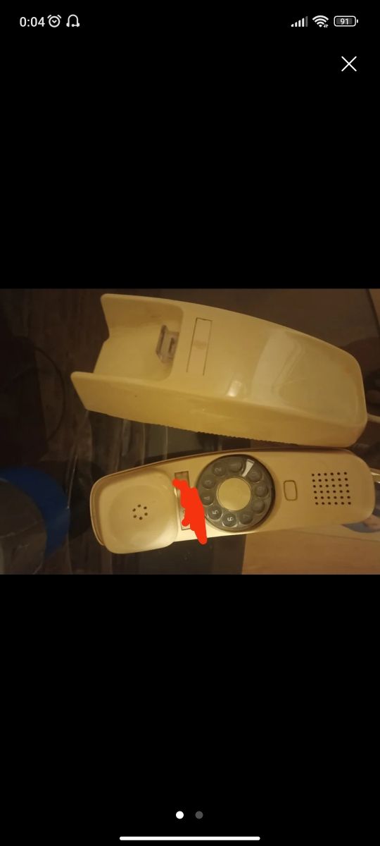 Teléfono giratorio de la pared, antiguo