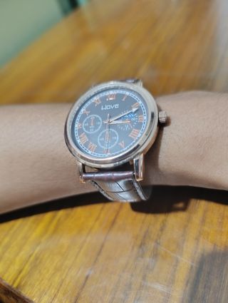 Reloj Wave marrón y dorado