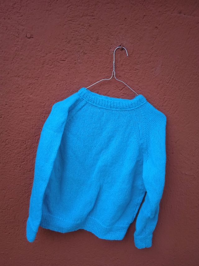 Jersei turquesa tejido a mano