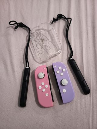 Dos Joy-Con Nintendo Switch y agarradera