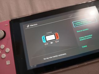 Dos Joy-Con Nintendo Switch y agarradera