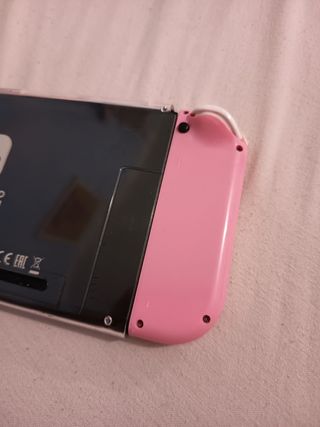 Dos Joy-Con Nintendo Switch y agarradera