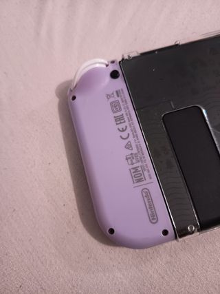 Dos Joy-Con Nintendo Switch y agarradera