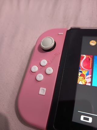 Dos Joy-Con Nintendo Switch y agarradera