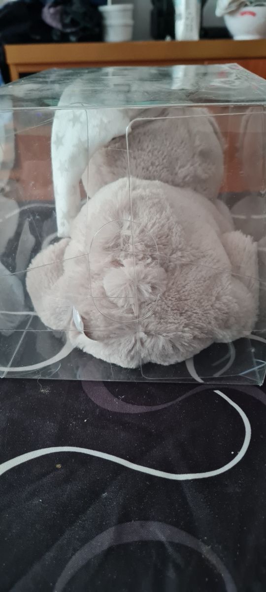 Muñeco calientacama gris