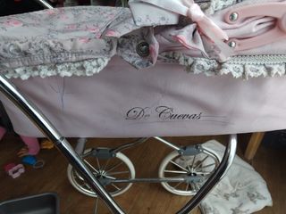 Carro muñecas De Cuevas rosa.