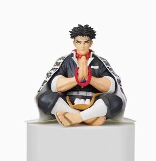 Figuras de Demon Slayer comiendo bolas de arroz